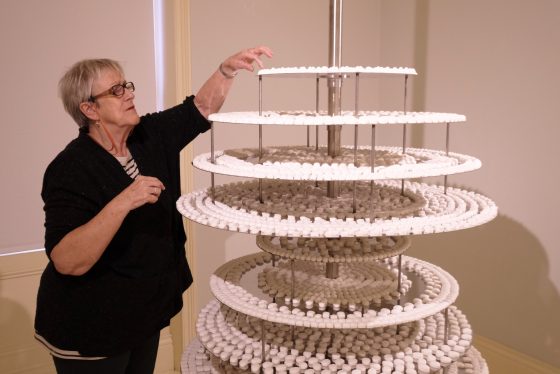 Artist Bobby Baker and puts the finishing touches to her 4,701 peppermint cream meals sculpture during the Great & Tiny War installation
